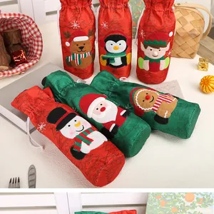 Detailed view of assorted Christmas wine bottle covers featuring Santa and Snowman designs
