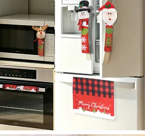 Festive Christmas snowman and Santa Claus appliance handle covers in a kitchen setting