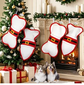 Detailed view of bone and fish shaped pet Christmas stockings hanging by a festive fireplace.