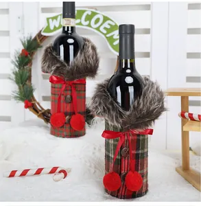 Detailed view of plaid Christmas wine bottle covers with faux fur and red bows