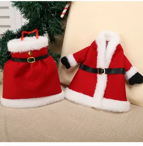 Detailed view of red Santa-style wine bottle covers for festive table decoration.