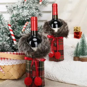 Festive Christmas plaid wine bottle covers with faux fur collars and red bows decoration.