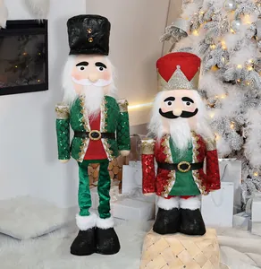Two large sequined Christmas nutcracker soldier dolls in a cozy festive home setting