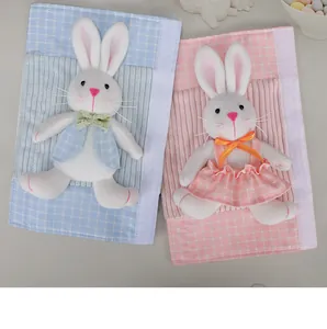 Pair of cute Easter bunny refrigerator handle covers in pink and blue plaid fabrics.