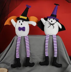Two Halloween ghost plush dolls with long striped legs and witch hats sitting on a display