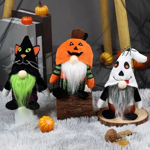Close-up detail of a three-piece Halloween gnome set featuring cat, pumpkin, and ghost themes