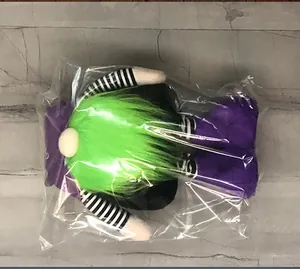 Halloween gnome plush doll with green hair and purple feet in clear plastic packaging
