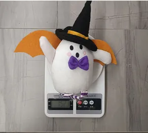 Detailed view of Halloween ghost plush with witch hat and bat wings showing 152.3g weight