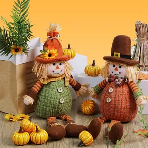 Set of two Thanksgiving scarecrow dolls with sunflowers for autumn harvest seasonal home decor
