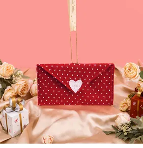 Detailed view of a red knitted Valentine's Day envelope decoration with a heart.