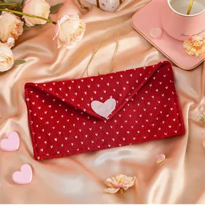Red knitted Valentine's Day envelope pouch with heart patterns on satin fabric