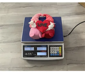 Valentine's Day gnome plush duo holding a heart, weighing approximately 72.5 grams