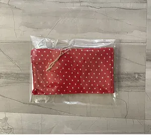 Red knitted Valentine's Day gift envelope pouch with white patterns in clear plastic packaging