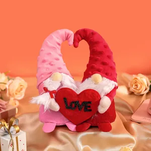 Pair of cute Valentine's Day plush gnome dolls holding a red love heart ornament decor