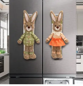 Pair of pastoral style plush rabbit covers for refrigerator door handles.