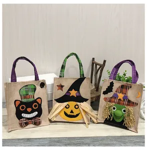 Set of three Halloween burlap gift bags featuring cat, pumpkin, and witch designs