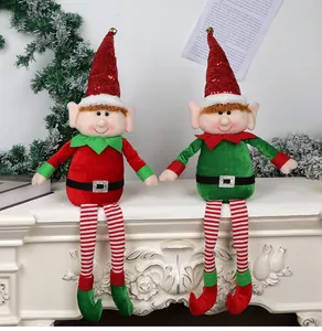 A detailed view showing two plush Christmas sitting elf dolls with long dangling legs