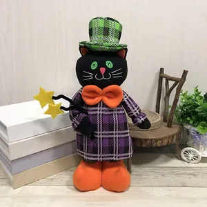 Halloween black cat plush doll decoration wearing a green plaid hat and purple outfit.
