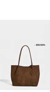 Detail view of a vintage brown suede large capacity tote bag with minimalist shoulder strap design