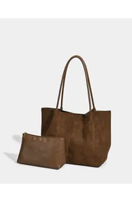 Large vintage brown suede tote bag set with matching zipper pouch on white backdrop