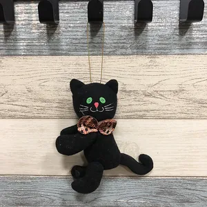 Handgefertigtes schwarze Katze Plüschtier mit Karoschleife für Halloween