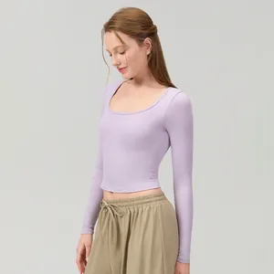 Women's slim fit lilac yoga long sleeve top with breathable U-neckline and built-in bra pads