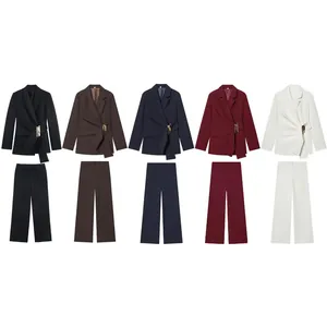 Elegant women's suit set featuring buckle-decorated blazer and matching straight trousers.
