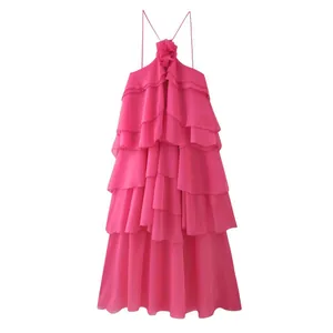 Vibrant fuchsia tiered ruffle dress with elegant floral halter neck detail for summer