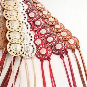 Detailed view of bohemian style belt featuring colorful round discs and metal eyelets