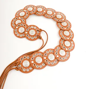Detail view of Bohemian belt featuring brown leather discs and silver metallic studs