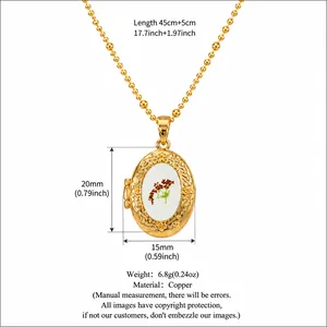 Vintage oval gold locket necklace featuring white face and red floral design with measurements