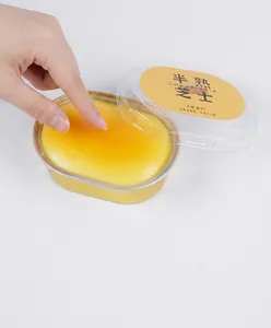 Detailed view of realistic semi-baked cheesecake squishy toy for stress relief