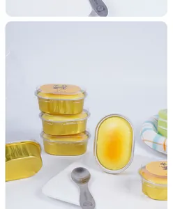 Close-up of slow rebound squishy toy shaped like half-baked cheesecake in gold foil cup.