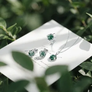 Elegant S925 silver jewelry set with green moss agate ring, necklace, and earrings
