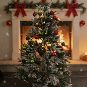 Frosted Christmas tree with colorful 100pcs ball ornaments in cozy fireplace setting