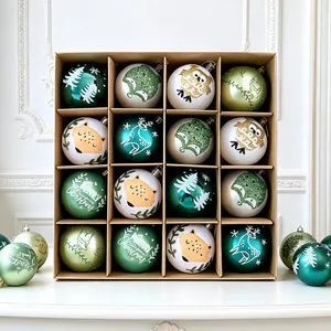 Close-up of set of 16 decorative Christmas ornaments with fox and deer patterns in a box.