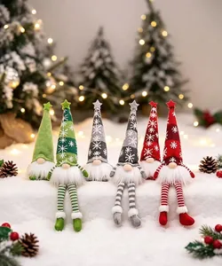 Detailed view of six festive Christmas gnomes with colorful hats on snowy background