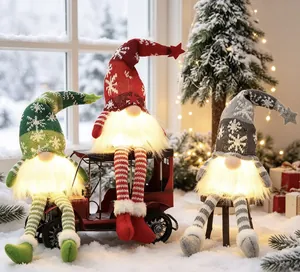 Three glowing Christmas gnomes with snowflake hats on snowy winter window backdrop