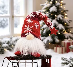 Detailed view of a plush Christmas gnome with snowflake hat in a festive snowy setting