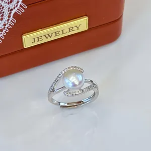 Macro view of a shimmering freshwater pearl ring with zircon accents and adjustable band