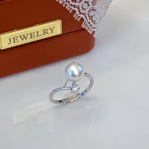 Close-up of elegant freshwater pearl ring with zircon accent on a jewelry box