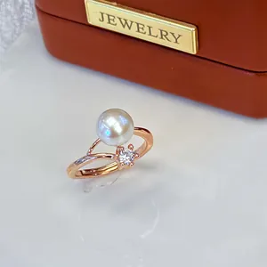 Close-up detail of elegant rose gold adjustable ring with a large freshwater pearl