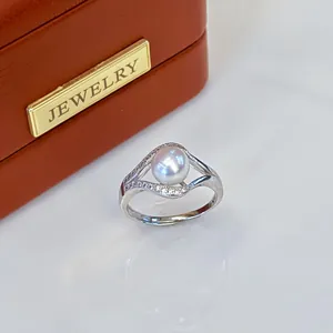 Elegant freshwater pearl ring with pave accents displayed on a stylish jewelry box