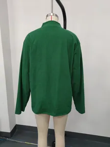 Detailed back view of a men's green corduroy long sleeve polo shirt featuring a stand collar