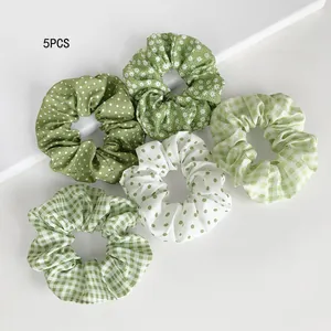 5PCS green patterned scrunchie set including floral, polka dot, and gingham designs.