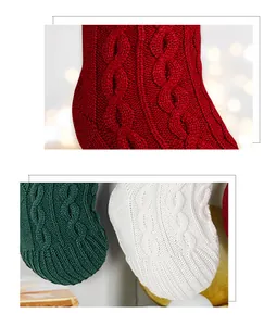 Close-up of thick cable knit Christmas stockings in red, green and white colors