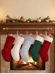Set of colorful cable knit Christmas stockings hanging by a fireplace for holiday decor
