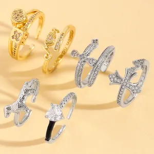 Collection of adjustable zircon rings featuring cross, heart, and Mom designs