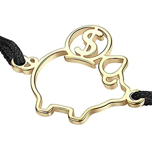 Goldener hohler Sparschwein-Anhänger mit Dollarzeichen für die Schmuckherstellung