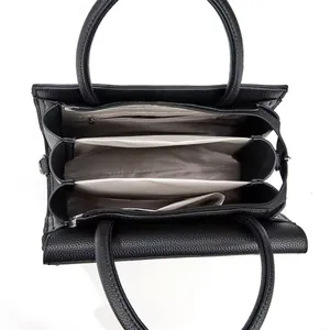 Internal structure of a black PU leather handbag featuring multiple compartments.